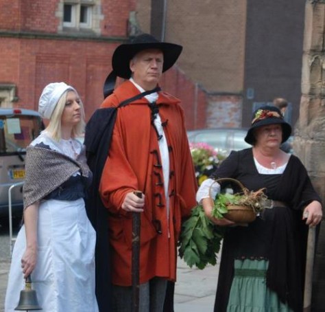 Gerrard Winstanley and two of his supporters outside the Gerrard Winstanley building in Wigan named after him.